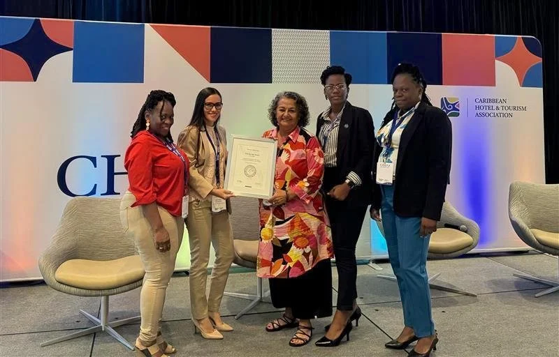 Magdalena Fielden, Co- owner of True Blue Bay Boutique Resort, Grenada, receiving the Platinum certification during the Caribbean Hotel Industry Exchange Forum (CHIEF).